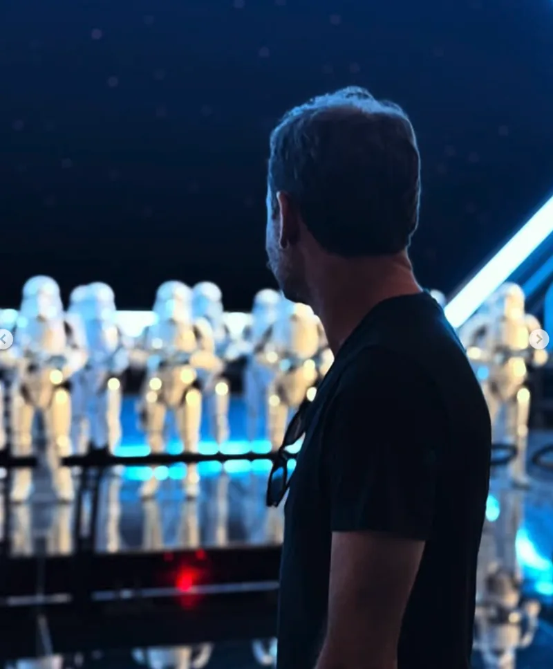 Owen Carter facing away from the camera, sizing up a display of Stormtrooper figures
